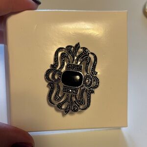 Black Brooch with Intricate Design